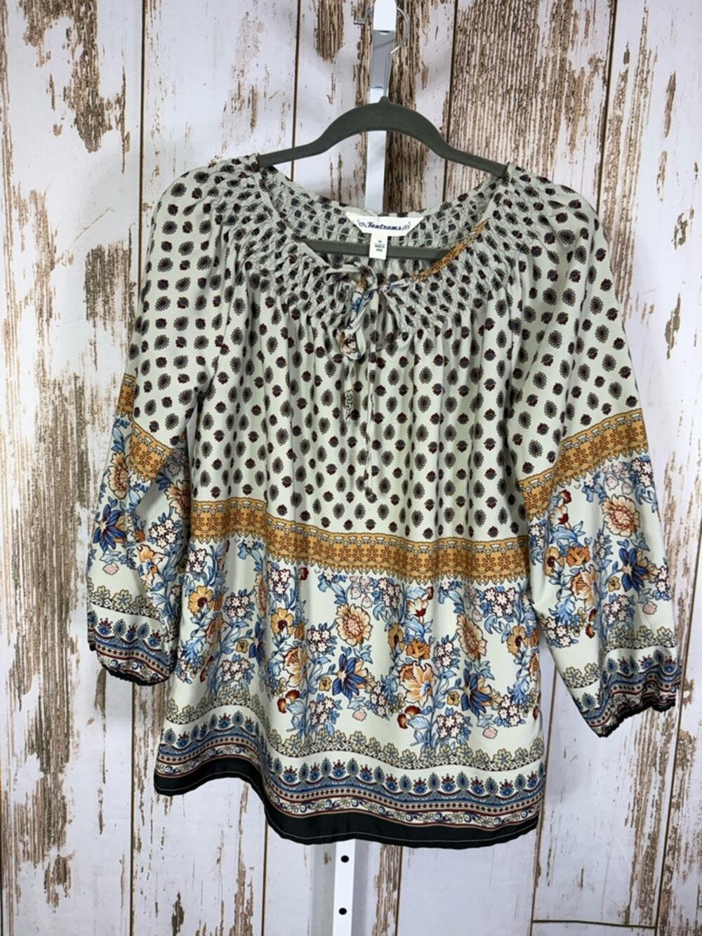 Tantrums, Cream Floral Border Peasant Top w/Blue and Gold Accents. Size Medium.